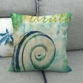 Square Aruba seashell pillow cover with teal shell pattern on a grey sofa - 18x18 Inch / Aruba Artistic Sea Snail (3)