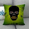 Close-up of green Halloween cushion cover featuring black skull and witch silhouettes - Neon Green Skull Witch Design Style (19)