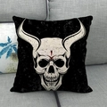 Macro detail of skull print on linen cushion cover showing vintage texture and fabric - Black Background Horned Skull Style