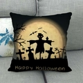 Detail of Halloween linen pillowcase featuring spooky moonlight scenery on a grey sofa - Scarecrow Tombstone Happy Halloween (11)