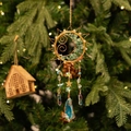 Boho crystal suncatcher with golden sun-moon frame and green natural stone accents - Smiling Sun Style