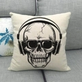 Linen cushion cover with cool black skull wearing headphones on a gray sofa - Skull with Headphones and Sunglasses Style