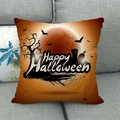 Orange Halloween throw pillow cover with Happy Halloween print and bats on a grey sofa - Orange Festive Background Style (9)