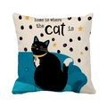 Linen pillowcase with black cat on blue sofa and Home is where the cat is text - Black Cat Illustration Home Quote Style