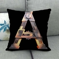 Detail of steampunk letter A cushion on sofa with gears and metallic rivets design - 45x45cm / Mechanical Style Letter A