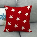 Star pattern red linen pillow cover displayed on a grey sofa for home decor - Red Background White Small Stars Style (1)