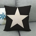 Square black linen pillow cover featuring a decorative off-white star pattern on a sofa - Black Background White Large Star Style (3)