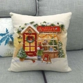 Linen Christmas pillow cover featuring a red Toy Store scene on a grey sofa - Winter Toy Store Hand-drawn (12)