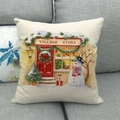 Close-up of a rustic Christmas linen pillowcase featuring a snowy village store illustration - Village Store Snow Scene (13)