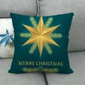 Détail de la housse de coussin en lin vert foncé avec étoile dorée et imprimé Noël - Étoile de Noël Vert Émeraude (3)