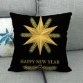 Detail of black linen cushion cover with gold Happy New Year star print on sofa - Black Happy New Year Star (6)