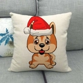Detail van kerstpuppy linnen kussensloop op een grijze bank met feestelijke print - Gekleurde puppy met kerstmuts (3)