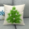 Close-up of linen Christmas tree pillow cover showing the natural fabric texture on a sofa - 45x45cm / Feathery Snowflake Tree (6)