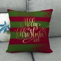 Close-up of red and green striped Christmas pillow case with golden Merry Christmas text - Merry Christmas Gold Text Style