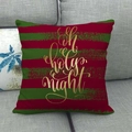 Detail of linen pillow cover with red and green stripes and golden Oh holy night text - Oh Holy Night Style