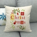 Macro detail of Christmas themed linen pillowcase on sofa with festive holiday pattern - Christmas Decorations Mix (5)
