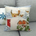 Detailed close-up of Christmas linen pillowcase featuring winter cabin and robin birds - Winter Snow Cabin (18)