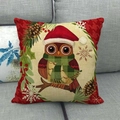 Christmas owl linen pillow cover with red hat and green scarf on a grey fabric sofa - Cartoon Owl