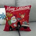 Red Christmas linen pillowcase with Santa driving a gift truck on a gray sofa - Red Truck Christmas Style (10)