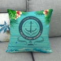 Maritimes Anker-Leinenkissen mit tropischen Motiven auf grauem Sofa für die Deko - Nautisches Element Urlaubsstil (3)