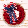 Detail of USA Independence Day wreath with burlap, red mesh and large patriotic bow - Wrinkled Cloth Wreath