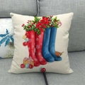 Detail of Christmas linen cushion cover featuring festive boots and robin bird print - 45x45cm / Red Rain Boots with Robin (8)