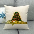 Christmas tree linen pillowcase with Merry Christmas text on a grey sofa - 45x45cm / Red Polka Dot Radiant Tree (17)