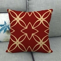 Detail of red linen cushion cover with beige star patterns on a grey sofa - Red Beige Star Floral (2) / 45x45cm
