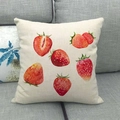 Linen cushion cover with vibrant watercolor strawberry print on a gray sofa - Six Scattered Watercolor Strawberries (17) / 18x18 Inch