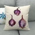 Artistic watercolor red onion print on a rustic linen pillowcase on a grey sofa - Red Onion Style (5)