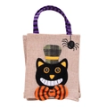 Dettaglio del sacchetto regalo di Halloween con gatto nero, ricamo di ragno e manici a righe - Stile Gatto Nero