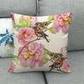 Linen pillow cover with floral and bird pattern on a gray sofa in a home setting - Chinese Pink Flowers and Pairs of Colored Birds (8)