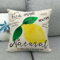 Square linen throw pillow featuring vibrant yellow lemon prints on a grey sofa - Natural Organic Lemon Pattern (11) / 18x18 Inch