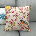 Linen square pillowcase featuring vintage plum blossom and bird print on a gray sofa - Off-white Background Blue Head Tit Bird (9)