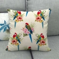 Linen cushion cover featuring tropical red parrot and hibiscus flower print on sofa - Tropical Parrot and Hibiscus (1)