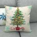 Nordic linen Christmas tree pillow cover with colorful ornaments on a grey sofa - Christmas Tree Style