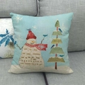 Linen Christmas snowman throw pillow cover with festive bird and tree on grey sofa - Snowman And Christmas Tree Collage Style