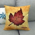 Close-up of a linen autumn pillowcase with a red leaf and Autumn text on a grey sofa - 45x45cm / Deep Red Autumn Leaf Decoration Style (6)