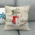 Detail of Christmas snowman pillow cover on gray sofa with linen texture and festive print - Snowman And Winter Street Scene Style