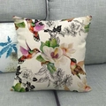 Linen square pillowcase with hummingbird and floral patterns on a gray fabric sofa - Traditional Flower and Bird with Magnolia Rose (13)
