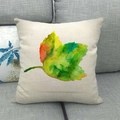Linen cushion cover featuring watercolor leaf print on a gray fabric sofa - Watercolor Art Leaves (9)