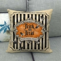 Detailed texture of linen Halloween pillowcase with Trick or Treat print on grey sofa - Halloween Text Fly (2)