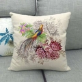 Linen cushion cover with vintage bird and floral print on a gray fabric sofa - Vintage Painted Bird and Flowers (16)