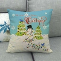 Christmas snowman pillow cover in light blue linen with holiday tree and snowflake motifs - We Wish You Merry Christmas Style