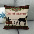 Close-up of Country Christmas linen pillowcase with horse silhouette on a grey sofa - Black Horse Sleigh (8)