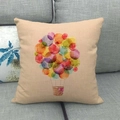 Linen cushion cover with watercolor hot air balloon print on a gray fabric sofa - Colorful Dots Hot Air Balloon (18)