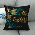 Black linen pillow cover with gold Happy Holidays floral design on grey sofa - Black Gold Floral Happy Holidays (1)