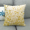 Close-up of star printed linen pillowcase showing texture on a grey sofa background - Beige Gold Bottom Dense Stars (13)