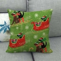 Close-up of Christmas dog linen pillowcase with snowflake and sleigh patterns on a sofa - Grass Green Christmas Dogs Sled Pattern (8) / 18x18 Inch