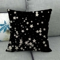 Square black linen pillow case with white scattered star pattern on a grey sofa - Black White Scattered Stars (9)
